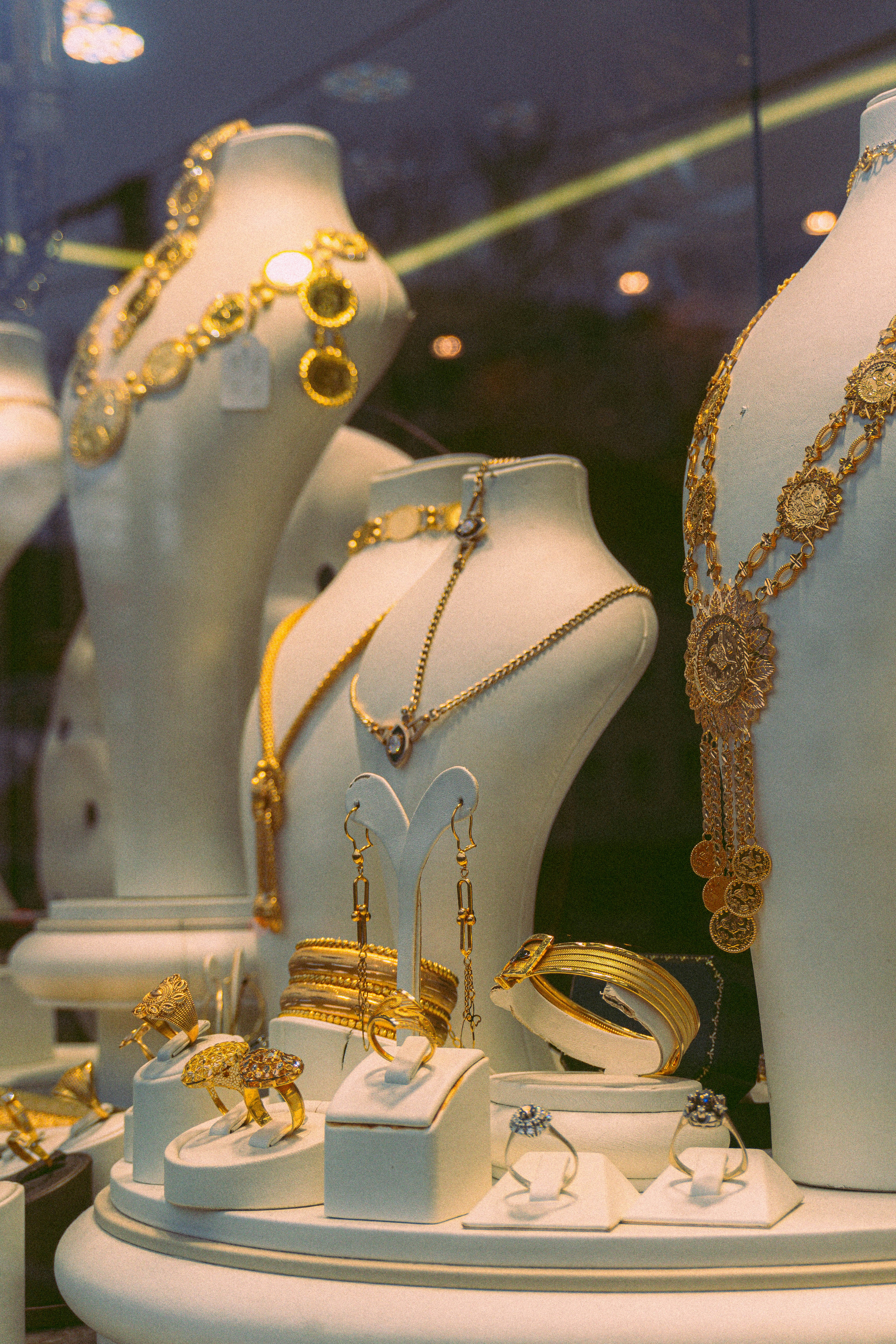 Rose gold hoop earrings and layered chains